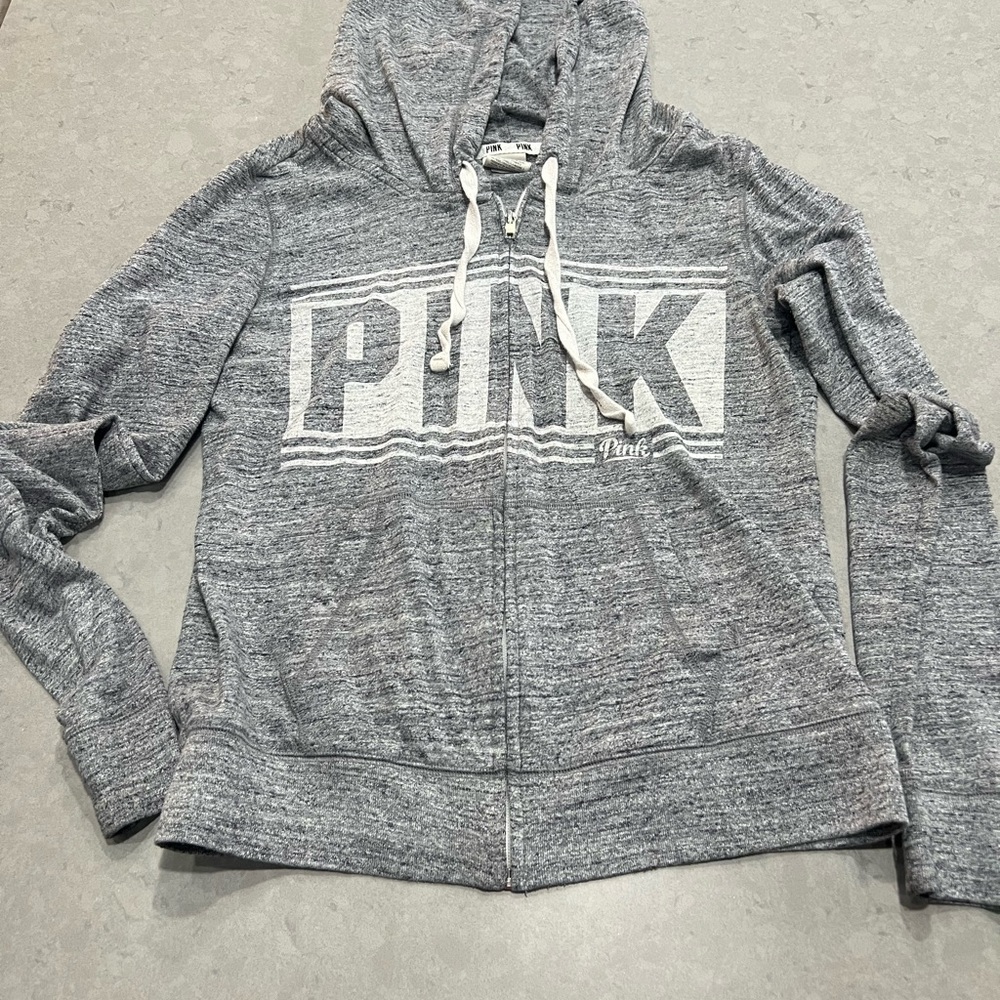 Pink Full zip light weight hooded jacket.